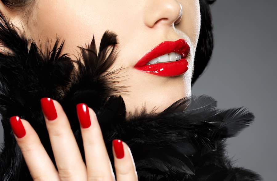young woman with red nails and lips young woman with red nails and lips